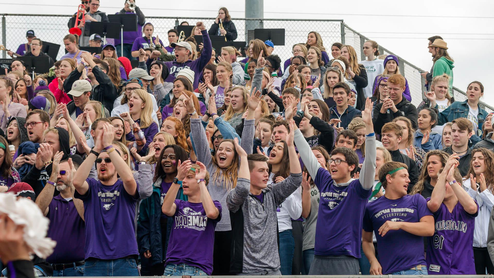 student section cheering at football game